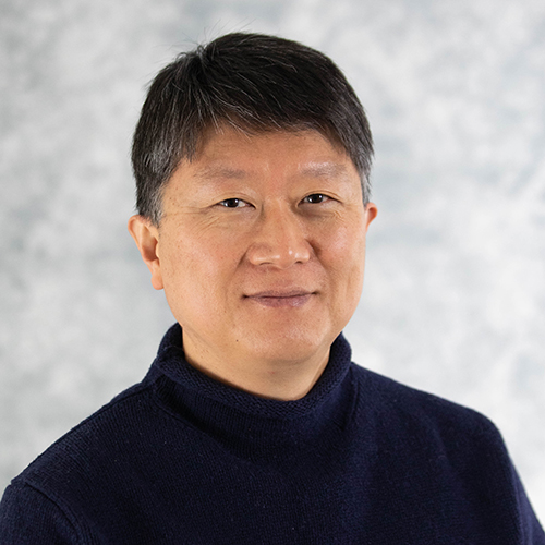 headshot of dark-haired person in dark shirt